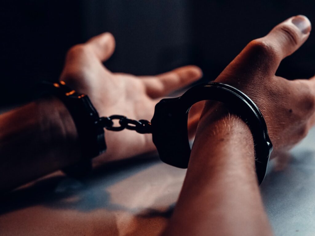 handcuffed wrists of a person in custody