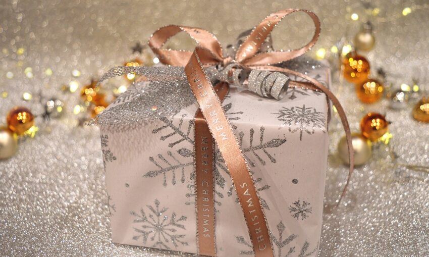 Square gift box with white, silver, and gold glitter wrap