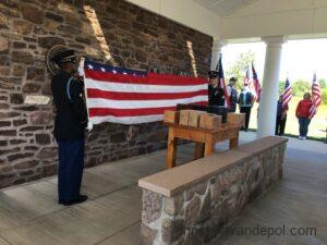 Photo of National Guard soldiers folding memorial U.S. flag at an Unattended Veterans Ceremony, at the Washington Crossing National Cemetery, 2019